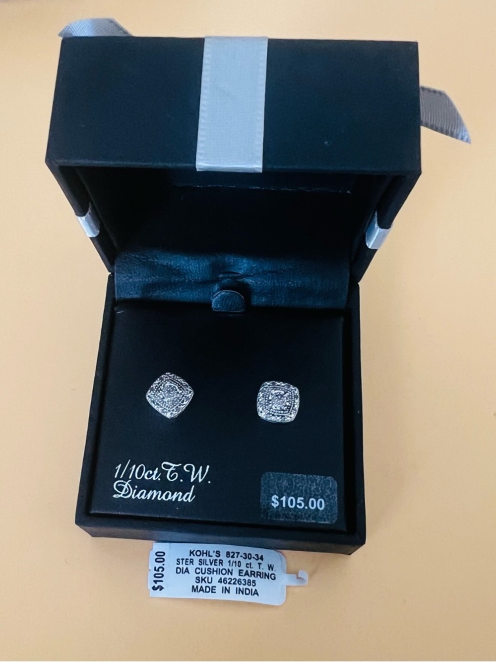 Sterling Silver Diamond Stud Earrings retails $105